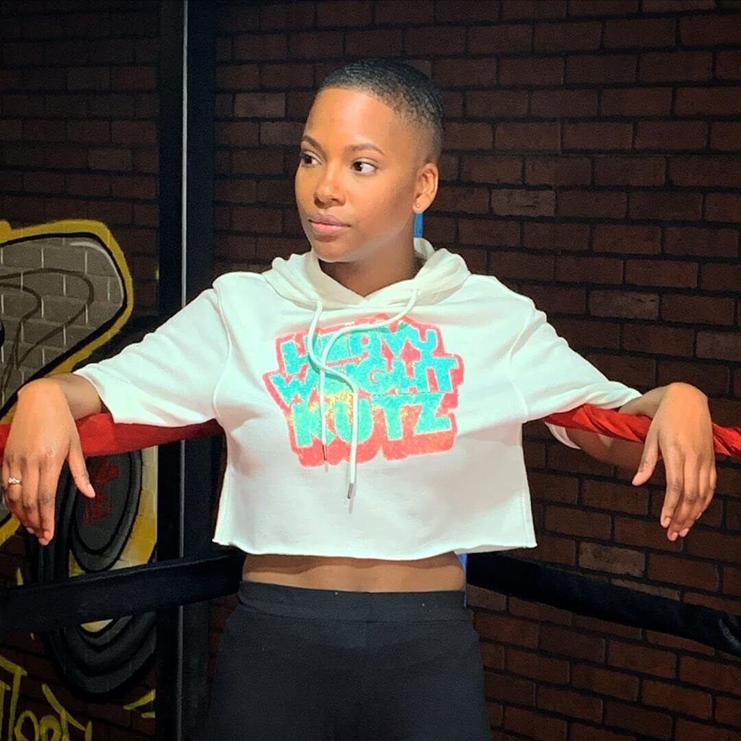 Client in a white Heavyweight Kutz cropped hoodie
